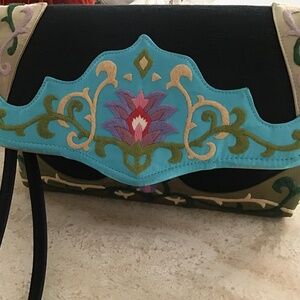 Hand embroidered clutch with cross body strap